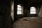 Interior of a large abandoned old dirty room with broken furniture
