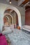 Interior of a large apartment in oriental mixed with loft style with arches, led lighting and bright orange elements