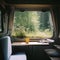 Interior of large caravan auto trailer, outside window sees beautiful natural landscape of forests