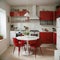 Interior of light kitchen with red fridge white counters and dining table