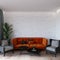 Interior living room design with orange sofa with grey armchair empty wall mockup