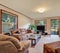 Interior of living room, family room with upholstered furniture