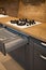 Interior of luxurious wooden modern kitchen grey cabinets