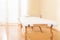 Interior of a massage or physical therapy treatment room with examination table.