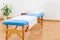 Interior of a medical treatment room with portable examination table. Vacuum cupping, massage or physical therapy.