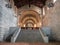 Interior of the medieval abbey of Abbadia San Salvatore, Italy. Stairway leading to the altar and side entrances to the