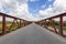 Interior of metal structure of a bridge in sunny day. Perspective to infinity at the bridge in Ukraine