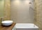 The interior of a modern bathroom with an overhead washbasin. Ecominimalism