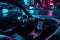 The interior of a modern car in a cyberpunk style is a futuristic blend of sleek lines, neon lighting, and high-tech