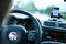 Interior of a modern car on a sunny day. Smartphone on mobile mount, used as navigation device