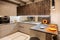 Interior of modern f kitchen with orange accents