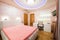 Interior of a modern orange bedroom with luxury colorful ceiling