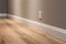 Interior of a modern room with wooden floor and lighted wall. baseboard.