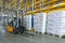 Interior of a modern warehouse with forklifts. Pallet stacker truck equipment at warehouse. Forklift loader