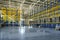 Interior of a modern warehouse storage of retail shop with pallet truck near shelves. Rows of steel shelves and racks