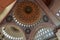 The interior of the mosque. The inner surface of domes and arches is painted in gold, silver, burgundy tones