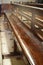 Interior of Notre Dame de La garde Cathedral, rows of pews, sunlight, selective focus, vertical frame, France, Marseille