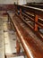 Interior of Notre Dame de La garde Cathedral, rows of pews, sunlight, selective focus, vertical frame, France, Marseille