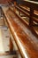 Interior of Notre Dame de La garde Cathedral, rows of pews, sunlight, selective focus, vertical frame, France, Marseille