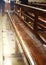 Interior of Notre Dame de La garde Cathedral, rows of pews, sunlight, selective focus, vertical frame, France, Marseille