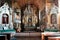 Interior of old 17th century wooden church from Matczyn with historic religious paintings and sculptures