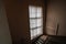 Interior with an old historical staircase and a huge stained glass window, the floors of the Museum