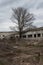 Interior of the old ruined abandoned barn for cows. Destroyed agriculture