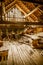 Interior of old wooden shed with scrap wood with sunrays