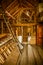 Interior of old wooden shed with scrap wood with sunrays