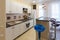 Interior of a one-room apartment, view of kitchen set and a bar counter