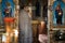 Interior of an Orthodox Ukrainian church. The priest prepares for the ceremony of the Sacrament of the Wedding