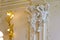 Interior of the palace with statues supporting the ceiling and beautiful stucco