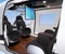 Interior of Passenger Drone equipped with ceiling monitor, luxury leather seats turned backward