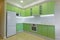 Interior photography large studio room with green modern kitchen