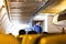 The interior of the plane with the pilot in the blurred background. People are entering the plane.