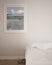 Interior poster mockup in minimal white bedroom with surreal lake panorama on white wall