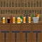 Interior of pub, cafe or bar with counter, glasses of beer, beer pump and ice pail. Inside drinking establishment.