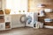 Interior of real laundry room with washing machine at window at