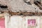 Interior remains of hurricane or earthquake disaster damage on ruined old house in the city with collapsed walls, roof and bricks