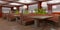 Interior of the restaurant, cafe. Leather sofas, wooden tables.