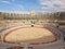 Interior of Roman amphitheatre with arena and bleachers in Arles, France