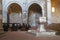 Interior of romanesque cathedral of Sovana with baptismal font