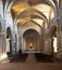 Interior of romanesque cathedral of Sovana in vertical composition