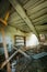 Interior Of Ruined Abandoned Country House With Caved Roof, Evacuation Zone After Chernobyl Disaster