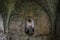 Interior of ruined hall with cracked, damaged walls and corridor in the St Hilarion ancient castle, Kyrenia