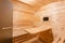 Interior of sauna. rural mobile wooden bath in the form of a barrel in a pine forest