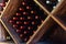 Interior setting featuring an array of different wine bottles on a wooden shelf