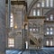 Interior shot of Nuruosmaniye Mosque with minbar platform, arches & colored stained glass windows, Istanbul, Turkey