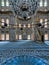 Interior shot of Nuruosmaniye Mosque overlooking niche Mihrab and marble minbar Platform facade, Istanbul, Turkey