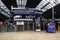 Interior shot of Queen Street Glasgow Railway Station during renovations.  Shows ticket barriers, signage and information kiosk